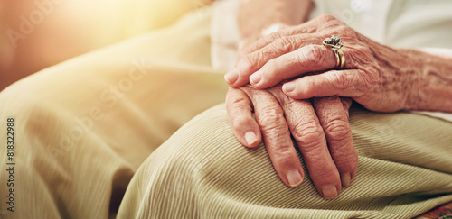 Closeup, morning and hands of senior woman in retirement home for thinking, reflection and nostalgia in house. Old age, living room and elderly person with ring for relaxing, calm and widow on sofa photo