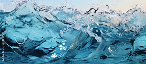 close up of a blue water wave with splashes and ripples