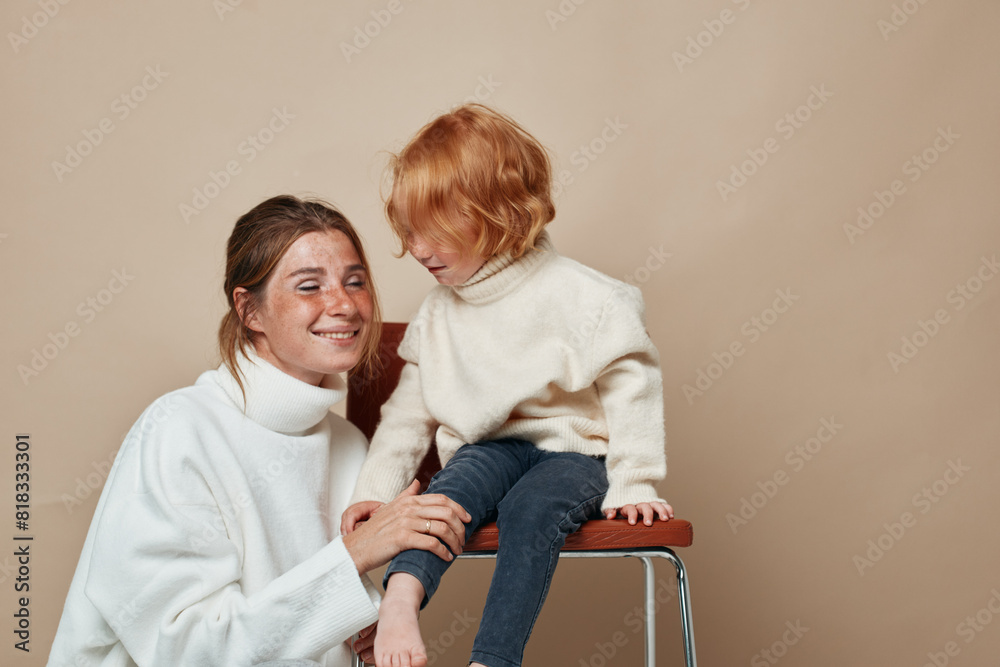 Family relaxation and bonding moment during travel, two generations together in a cozy armchair Family relaxation and bonding moment during travel, two generations together in a cozy armchair