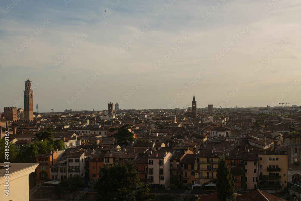 Sunset over the town in Verona, Veneto region, Italy. Beautiful view of the Italian city from above. Tourist places, travelling Sunset over the town in Verona, Veneto region, Italy. Beautiful view of the Italian city from above. Tourist places, travelling