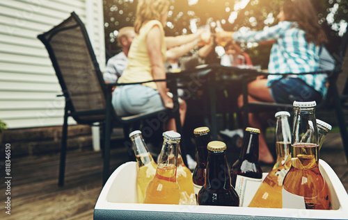 Group, people and drinks at barbecue in backyard, summer and vacation for holiday, celebration or event. Friends, cheerful and bbq with cooler box for dinner, party or reunion with alcohol in America