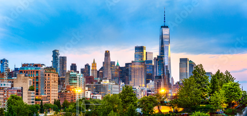 Panoramic view of Lower Manhattan skyline at at dusk, behind the Little Island public park.