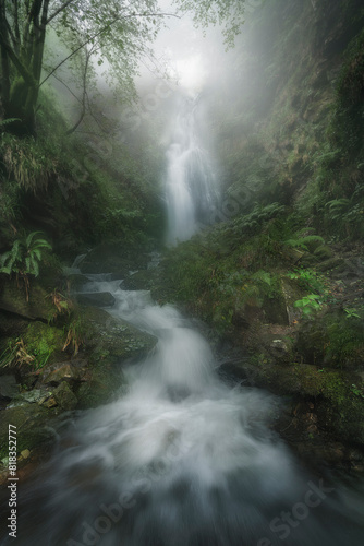 waterfalls in the Belaustegi beech forest in Orozko  Bizkaia in the Gorbea natural park on a foggy spring morning