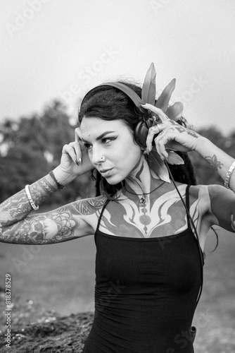 a black and white photo of a woman wearing headphones