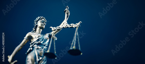 Lady Justice statue in law on blue background © Proxima Studio