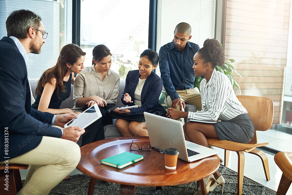 © peopleimages.com - Collaboration, laptop and meeting with business people in lobby of office for discussion or planning. Computer, project management and teamwork with employee group in workplace for administration