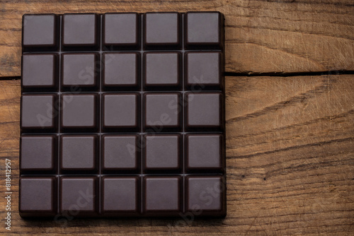 Dark chocolate on wood table