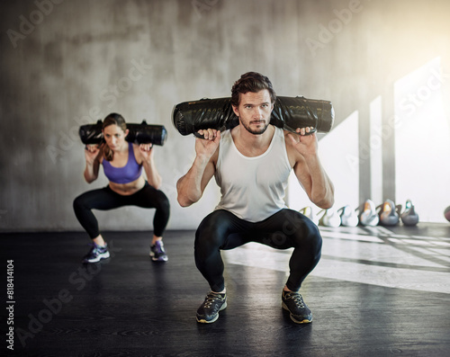 Fotografía Man, woman and squat with sandbag for gym exercise or leg strength for muscle building, discipline or athlete