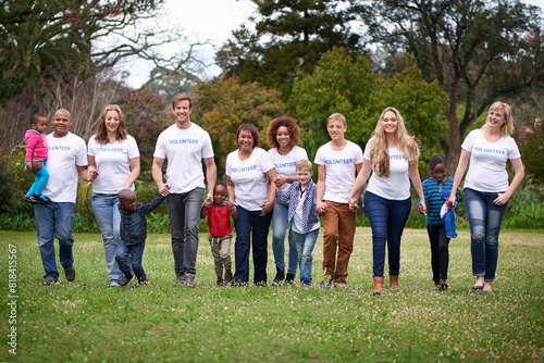 Portrait, park and volunteer with children, people or holding hands with smile, community service and summer. Group, men or women with kids, orphanage and shelter with adoption, charity and foster