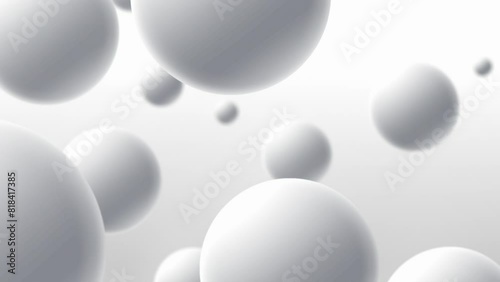 White spheres moving on a light background