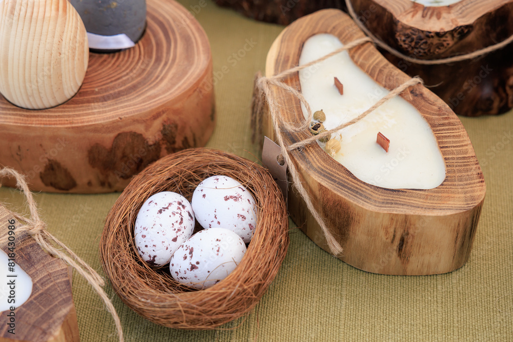 A wooden bowl with three eggs in it sits on a table A wooden bowl with three eggs in it sits on a table
