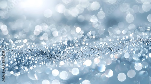Sparkling white glitter, scattered on the surface, with a blurred background and sunlight shining through the window onto it. 