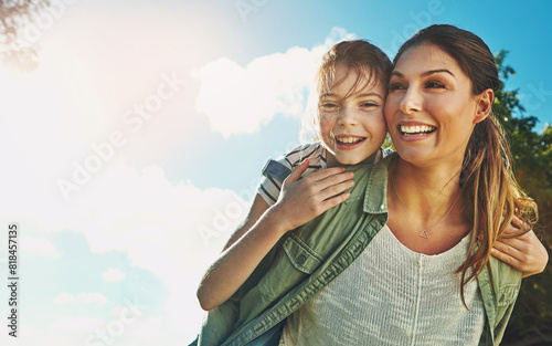 Mother, child and piggy back outside with happy family, fun and playing in park with blue sky for bonding or love. Summer, caring and attachment on relax holiday together, girl daughter and weekend