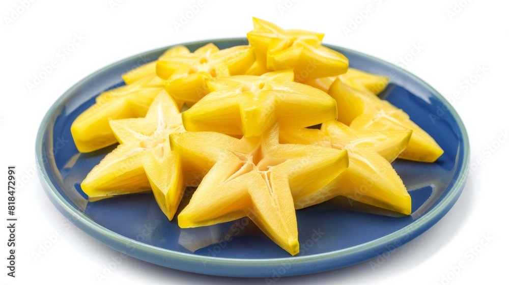 Sliced starfruit arranged on a vibrant blue plate, showcasing their bold yellow color and distinctive star shape. Sliced starfruit arranged on a vibrant blue plate, showcasing their bold yellow color and distinctive star shape.