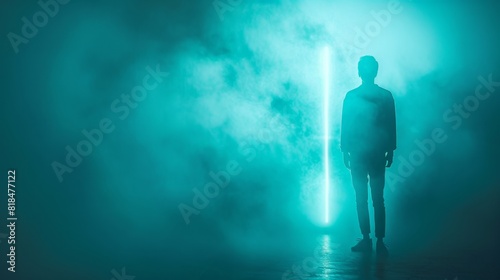 Faceless figure illuminated by neon lights  standing on a minimal teal background with space for text