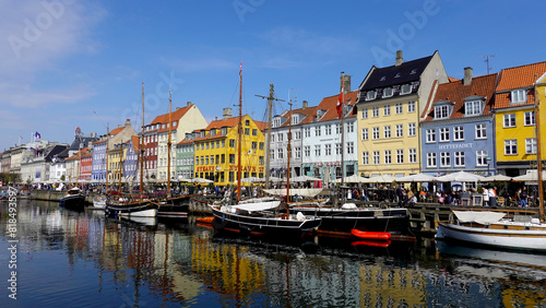 COPENHAGEN  DENMARK  APRIL 27  2024  Copenhagen iconic view. The popular Nyhavn port area with the colorful houses in the center of Copenhagen  Denmark during spring season sunny day