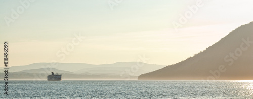 A BC Ferry navigates the ocean between Canada's gulf islands as it carries passengers between Victoria and Vancouver BC