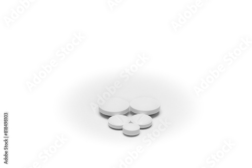 Five white generic pills arranged in a heart shape on white background.