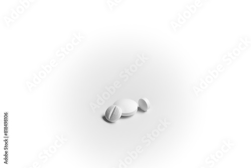 Three white generic pills on white background.