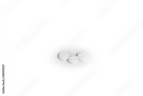 Three white generic pills next to each other on white background.