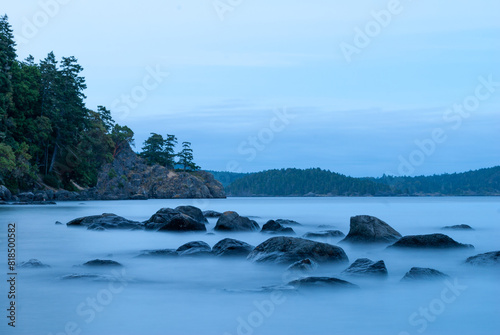 Mist like shore scene of the Pacific Ocean among the rocky shore of Vancouver Island seen at twilight. 