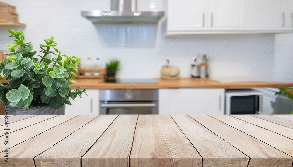 Fototapeta premium Wood table top with green plants on blur kitchen counter (room)background.