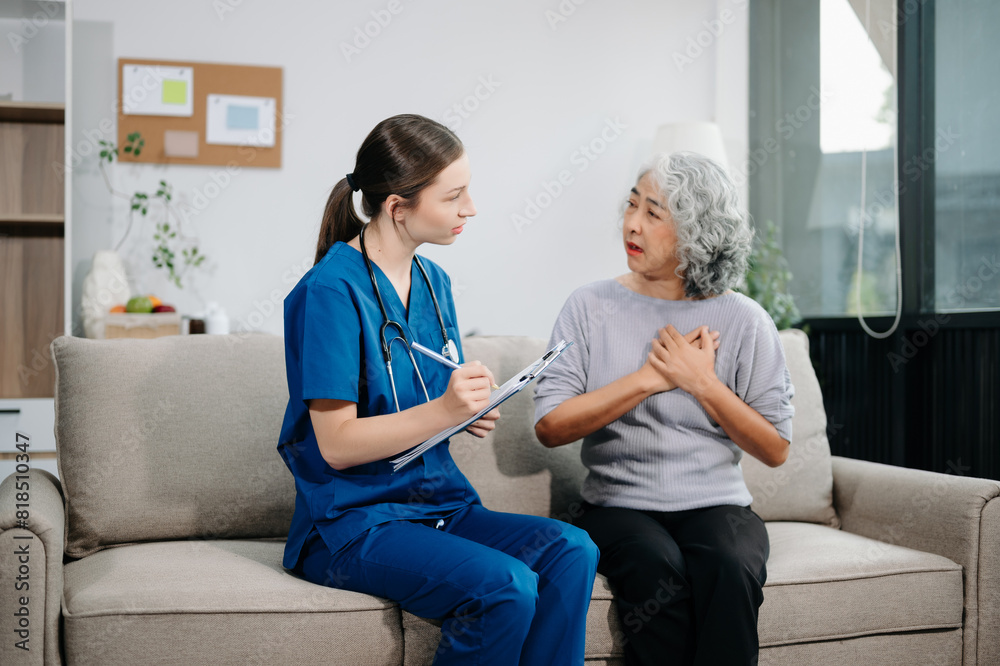 Doctors explain the use of medication to patients. Medical doctor holing senior patient's hands and comforting her on sofa Doctors explain the use of medication to patients. Medical doctor holing senior patient's hands and comforting her on sofa