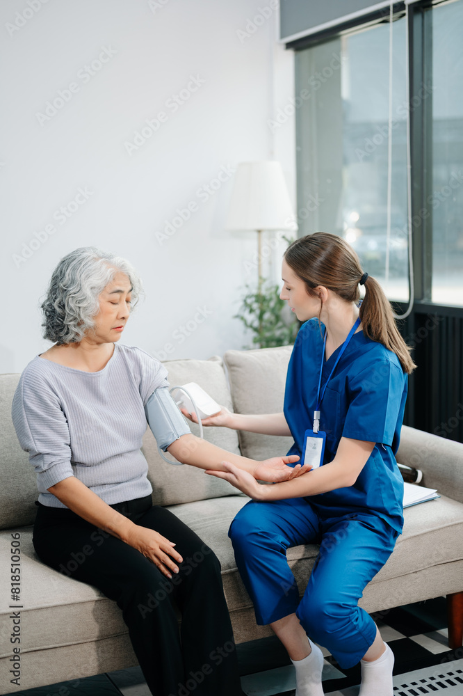 Doctors explain the use of medication to patients. Medical doctor holing senior patient's hands and comforting her on sofa Doctors explain the use of medication to patients. Medical doctor holing senior patient's hands and comforting her on sofa