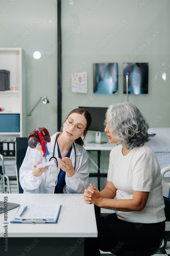 Obraz premium Doctor in white suit take notes while discussing and Asian elderly, man patient who lying on bed with receiving saline solution