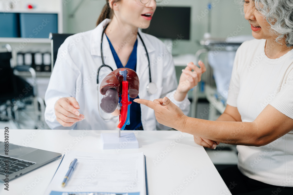 Doctor in white suit take notes while discussing and Asian elderly, man patient who lying on bed with receiving saline solution Doctor in white suit take notes while discussing and Asian elderly, man patient who lying on bed with receiving saline solution