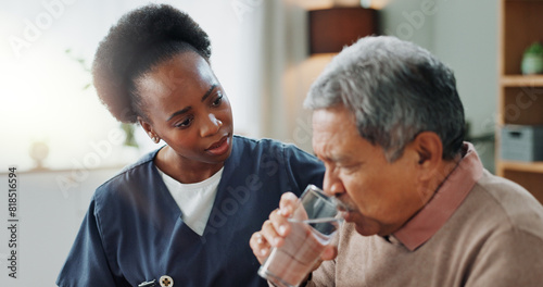 Senior, man and water from nurse for medicine, healthcare and support for healing tuberculosis. Sick, patient and elderly caregiver with person in home to help with tablet, supplements and drugs