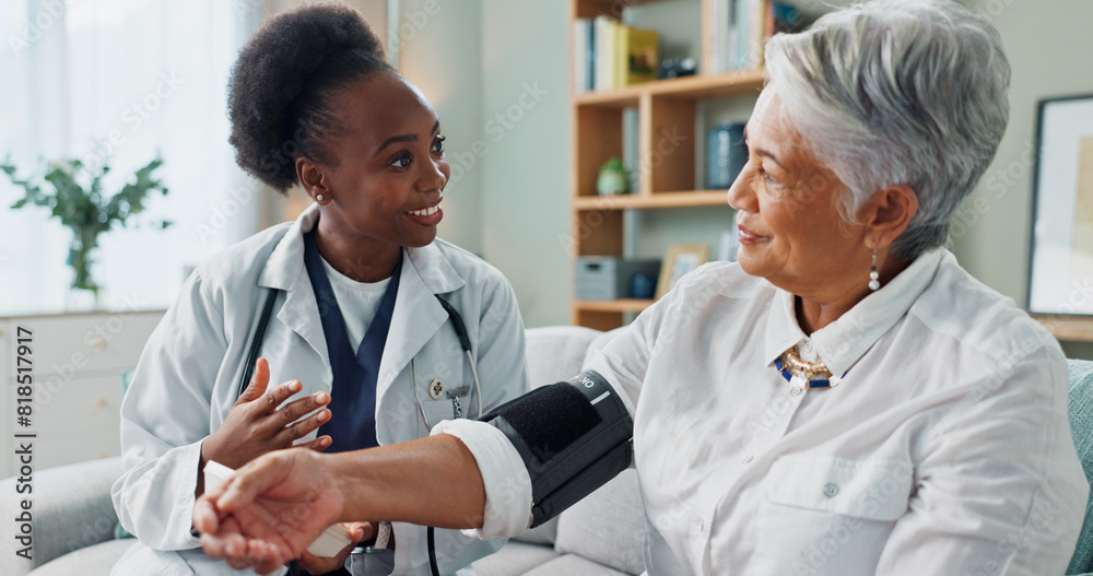 © peopleimages.com - Elderly, woman and doctor with monitor for blood pressure with hypertension diagnosis, medical test and cardiovascular. Senior patient, nurse and laughing in nursing home for healthcare assessment