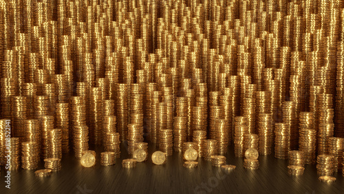 Hundreds of vertical Golden Bitcoins stacks are standing on the black wooden surface