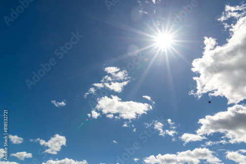 blue sky with white sun
