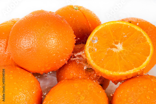 Refreshing oranges fruit with water drops