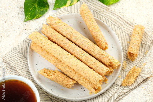 Egg Roll Biscuit or Kue Semprong or sapit, Simping, kue Belanda, or kapit or Love letters in English. It is an Indonesian traditional wafer snack