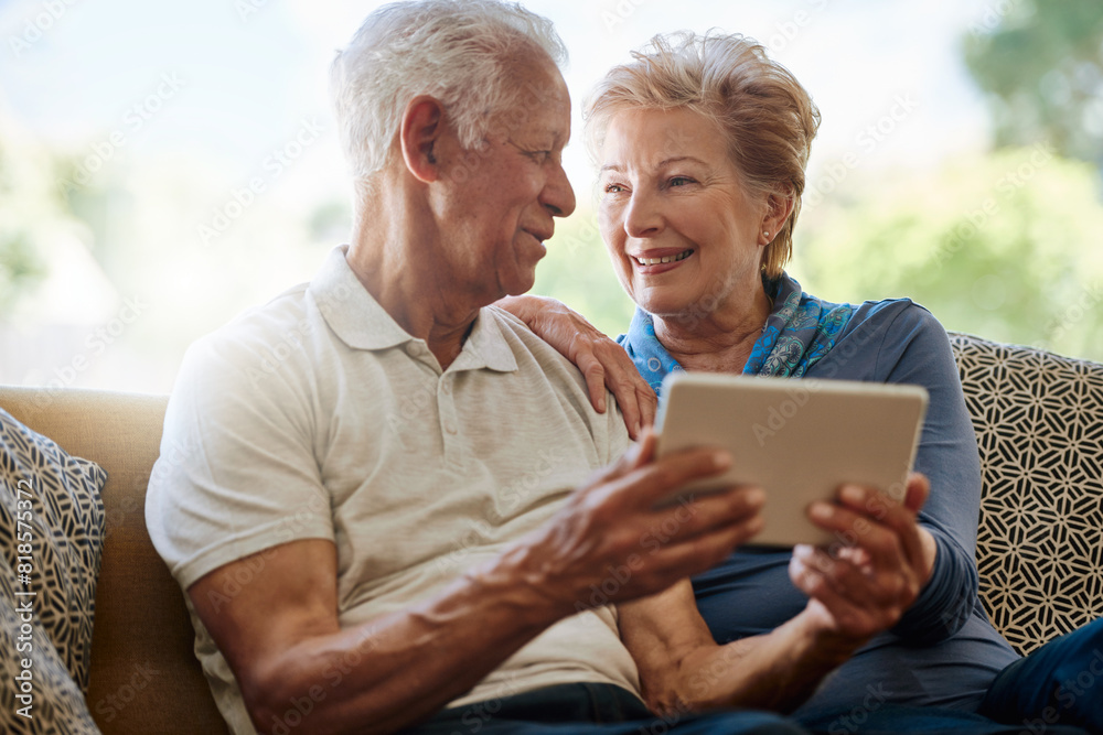 Mature couple, love and tablet in lounge, digital and online for download, watch and show on app in house. Conversation, man and woman with news to relax in home, smile and streaming of movie Mature couple, love and tablet in lounge, digital and online for download, watch and show on app in house. Conversation, man and woman with news to relax in home, smile and streaming of movie