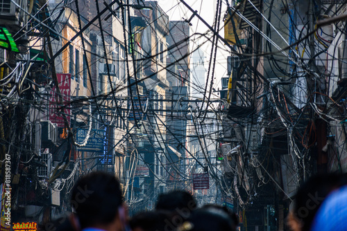 Maze of electrical wires at a street of Old Delhi, India.
