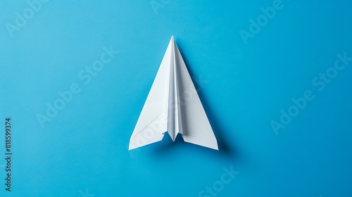 White paper plane on a blue background