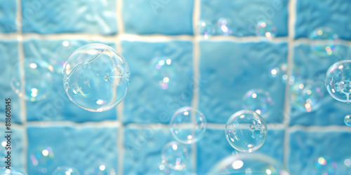 Skincare enjoying relaxation moment having bubble bath shower concept. Floating transparent soap bubbles in blue tile bathroom. 