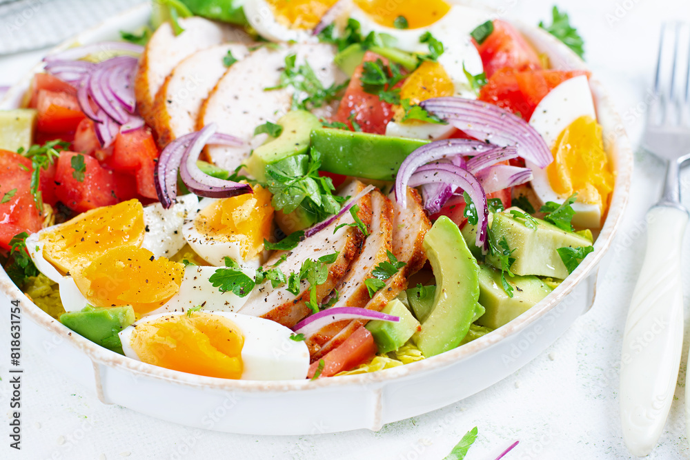 Healthy cobb salad with chicken, avocado, tomato, red onions and eggs. American food. Healthy cobb salad with chicken, avocado, tomato, red onions and eggs. American food.