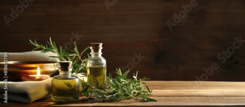 A spa composition featuring the aromatic essence of tea tree oil set against a rustic wooden backdrop The image provides ample copy space