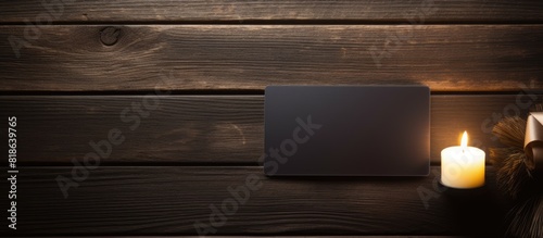 On a dark wooden table there is a carbon soap placed next to an empty gift card creating a visually appealing copy space image photo