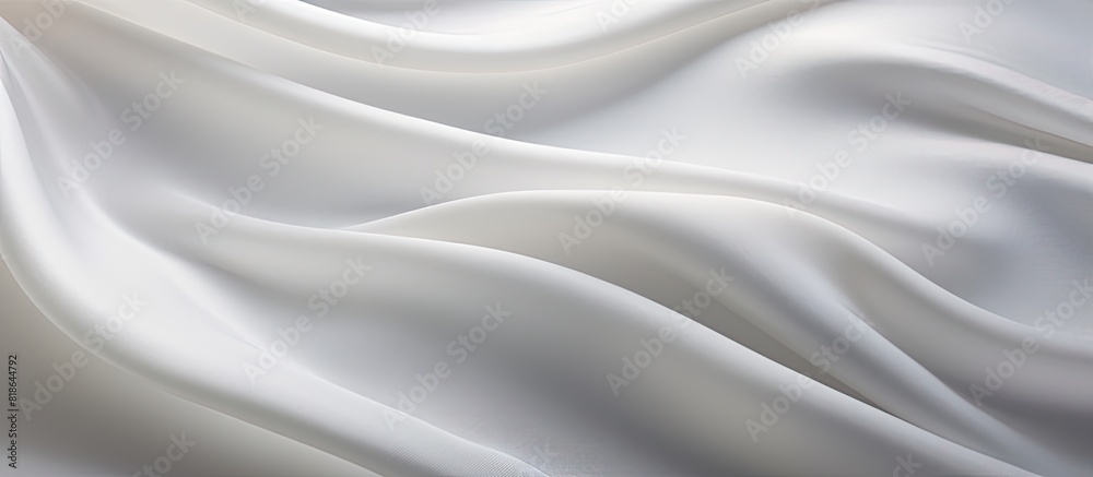 Closeup of a copy space image showcasing the delicate and textured ripples in a piece of white silk fabric