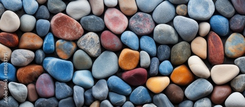 A colorful background of abstract small stones with a texture ideal for copy space image