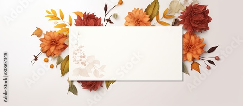 A fall themed invitation card with autumn leaves surrounded by an environment and various details is presented in a mockup with a white background featuring a postcard adorned with flowers and a ribb photo