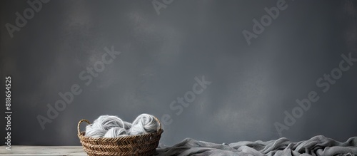 Gray background with threads of wool providing copy space for text