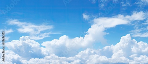Fototapeta Naklejka Na Ścianę i Meble -  The expansive blue sky with fluffy clouds as a copy space image