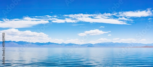 A picturesque landscape of QingHai lake with a panoramic view showcasing the serene bluesky and tranquil lake waters ideal for copy space images photo