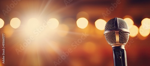 A detailed view of a microphone positioned in a concert hall with ample copy space in the image
